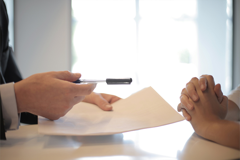 Signing a personal injury case document from sioux city lawyer