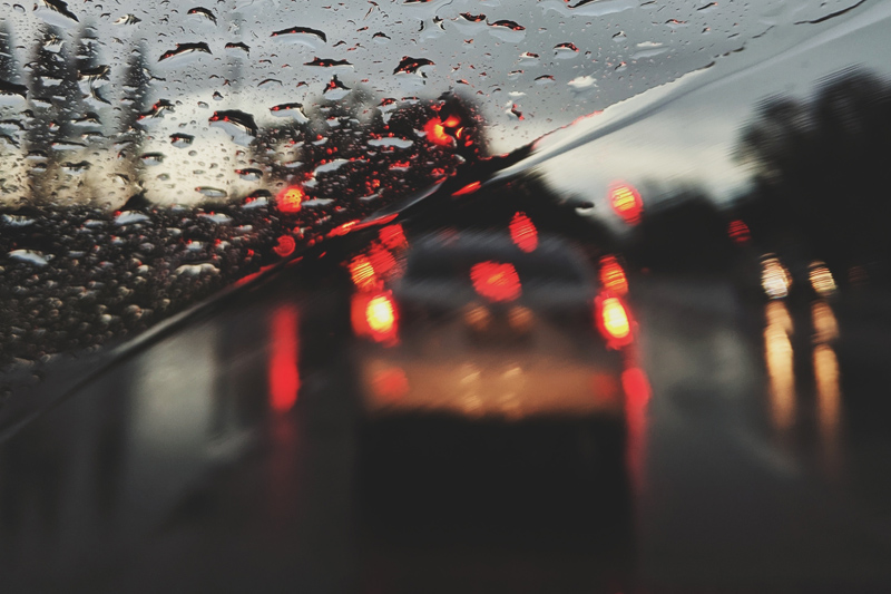 rear-end collision happening in the rain