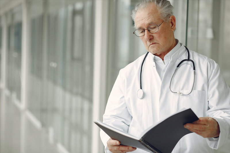 A doctor reading the results of personal injury accident.